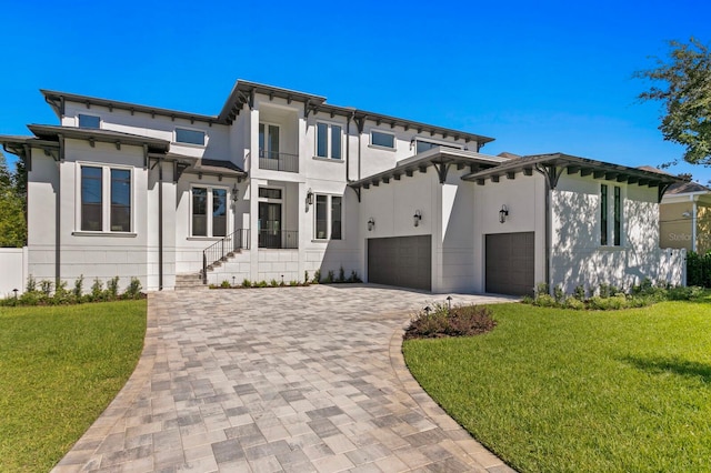 view of front of house featuring a front yard and a garage