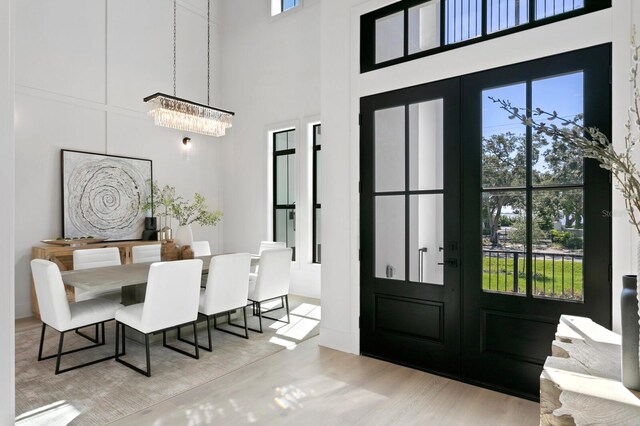 dining space featuring light wood-type flooring and a wealth of natural light