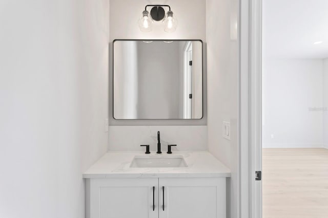 bathroom featuring vanity and wood-type flooring