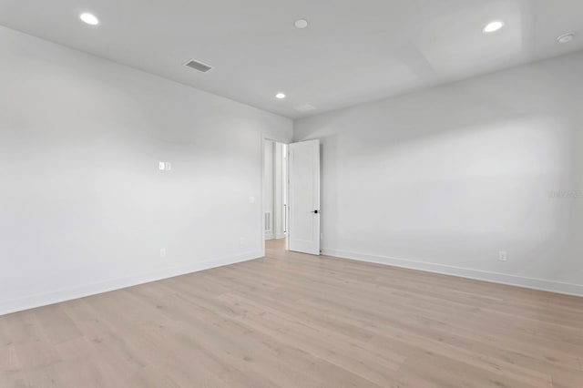 unfurnished room featuring light hardwood / wood-style flooring