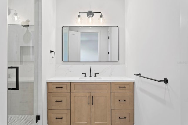 bathroom featuring vanity, walk in shower, and backsplash