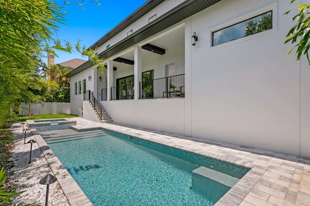 view of swimming pool with a patio area