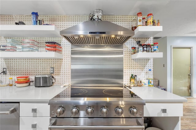 kitchen with light hardwood / wood-style floors, decorative backsplash, wall chimney exhaust hood, dishwashing machine, and high quality stove