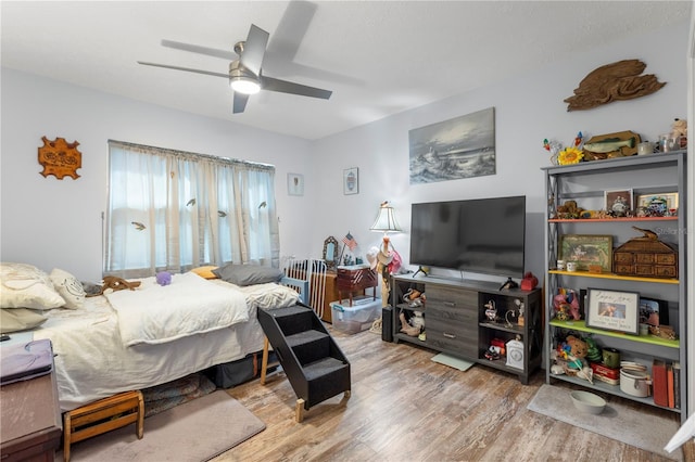 bedroom featuring ceiling fan and light hardwood / wood-style flooring