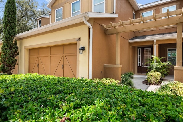 doorway to property featuring a garage