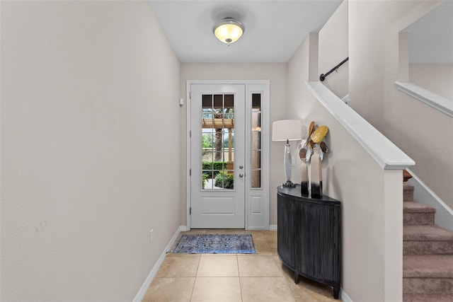 doorway to outside featuring light tile patterned floors