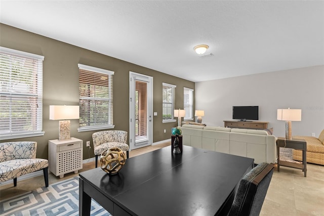 dining room featuring light tile patterned floors