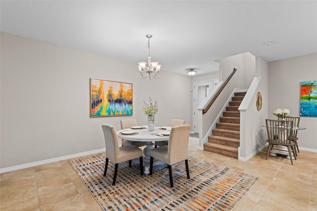 dining space with a chandelier and light tile patterned floors