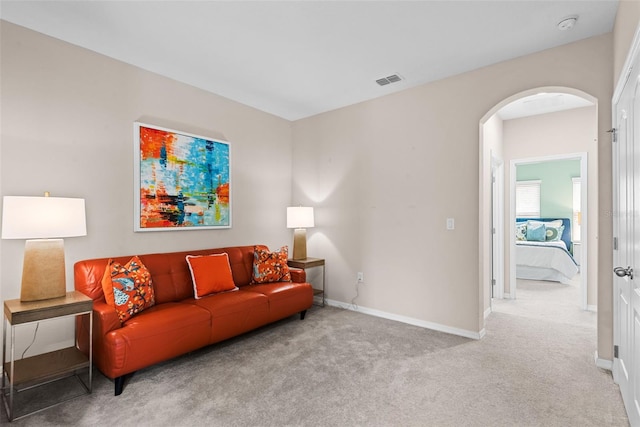 living room with light colored carpet