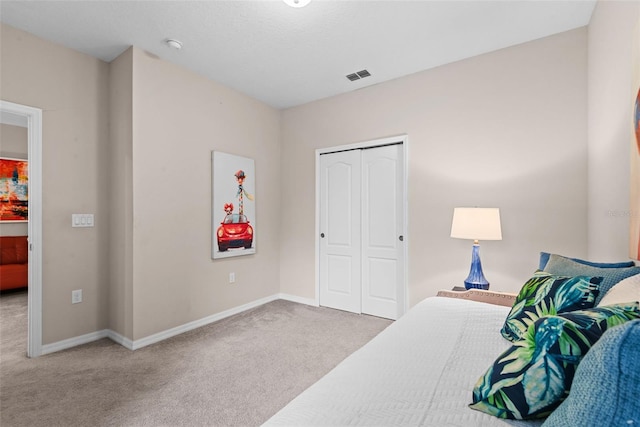 carpeted bedroom with a closet