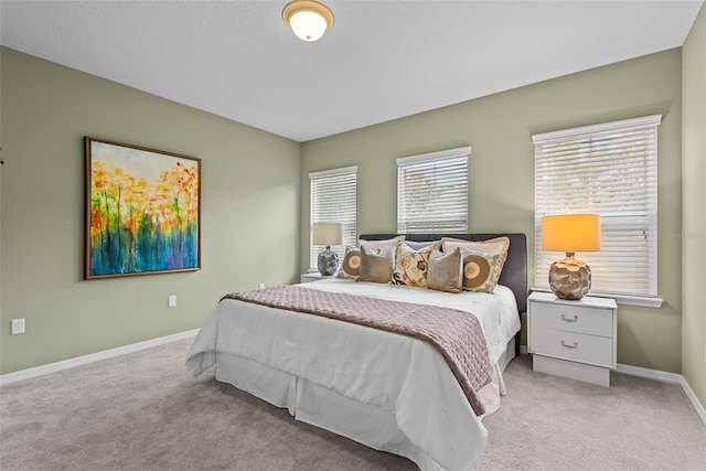 bedroom featuring light colored carpet