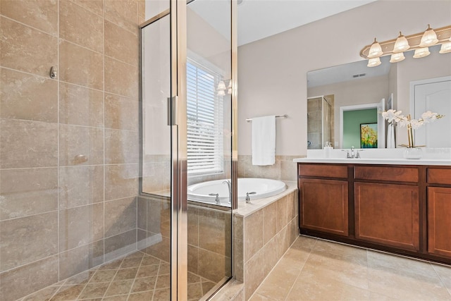 bathroom featuring vanity, tile patterned floors, and independent shower and bath