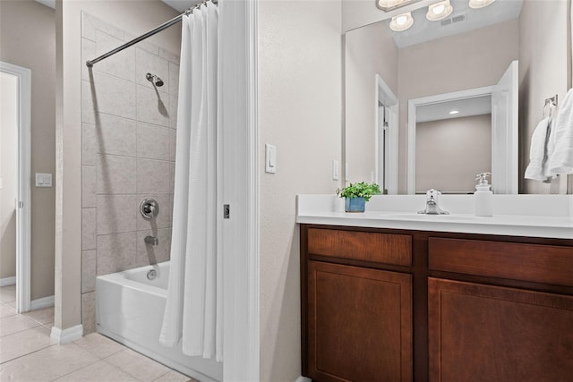 bathroom with shower / bath combo, vanity, and tile patterned floors