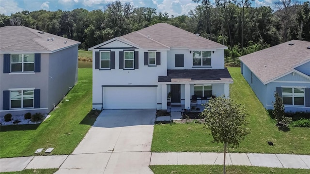 view of front facade featuring a garage and a front lawn