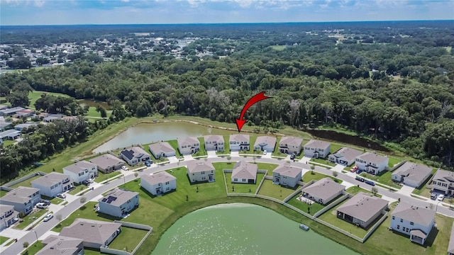 birds eye view of property featuring a water view