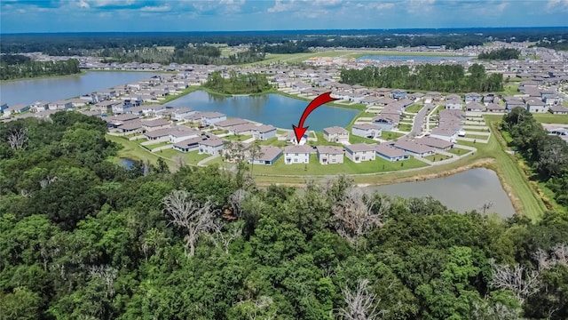 birds eye view of property with a water view