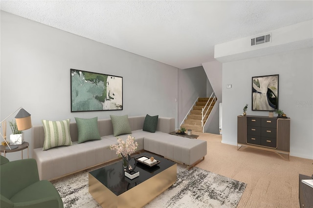 living room with carpet flooring and a textured ceiling