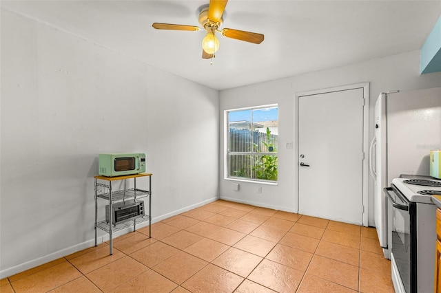 kitchen with ceiling fan, light tile patterned floors, and white appliances