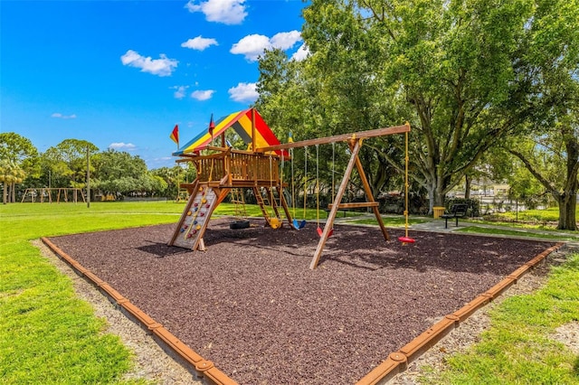 view of jungle gym with a lawn