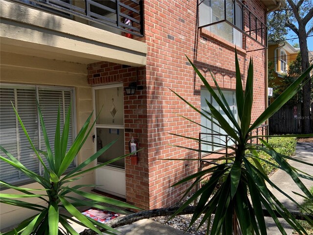 entrance to property featuring a balcony