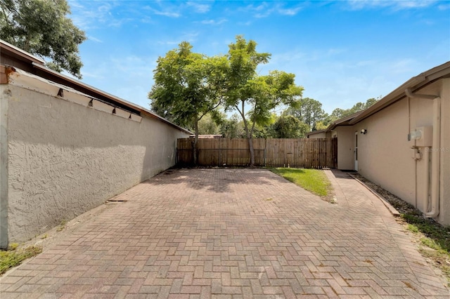 view of patio / terrace featuring fence