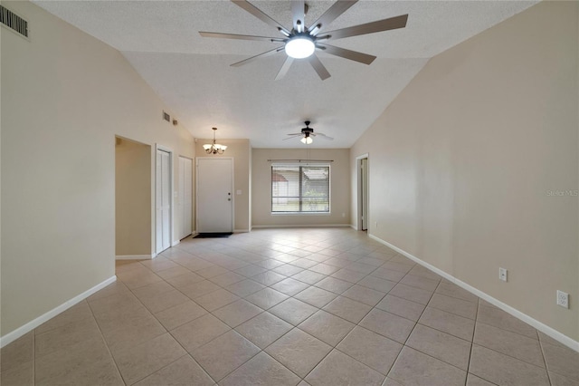 spare room with light tile patterned floors, baseboards, visible vents, and a textured ceiling