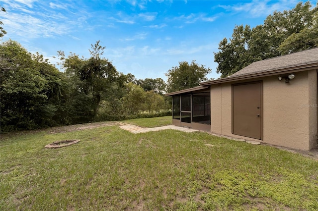 view of yard with a sunroom