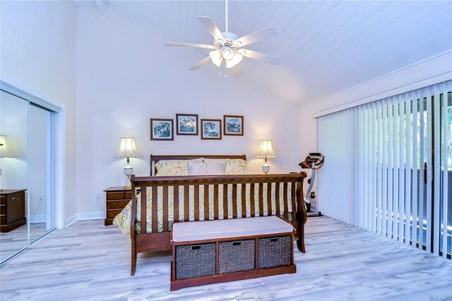 bedroom featuring a closet, lofted ceiling, ceiling fan, and wood-type flooring