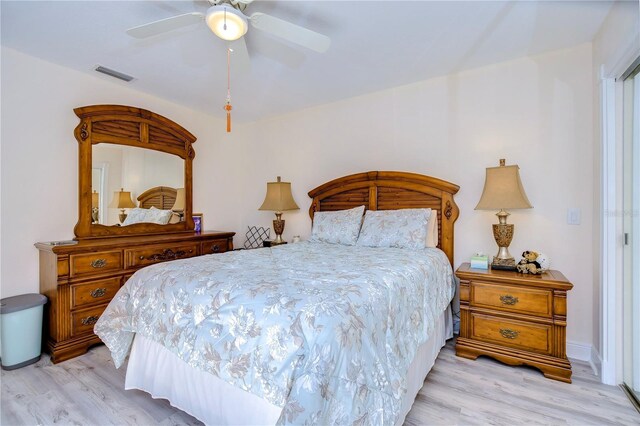 bedroom featuring light hardwood / wood-style flooring and ceiling fan