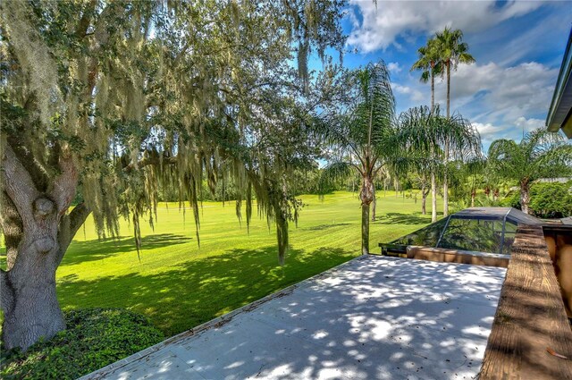 view of property's community with a lawn