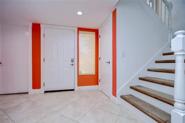 foyer entrance featuring light tile patterned floors