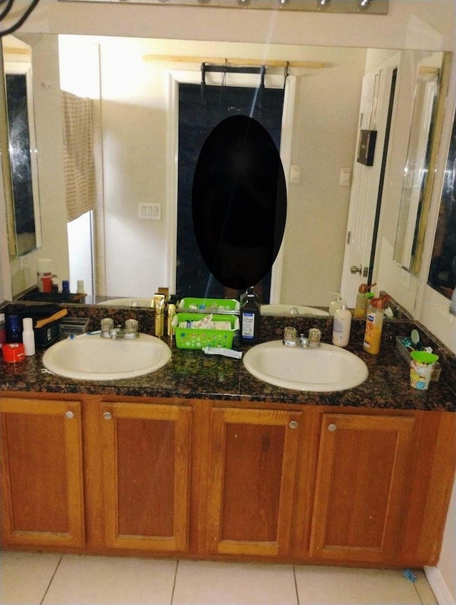 bathroom featuring vanity and tile patterned flooring