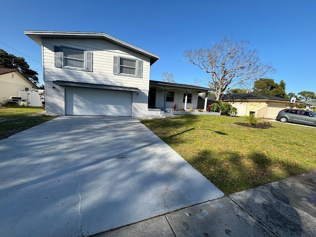 view of front of house with a front yard and a garage