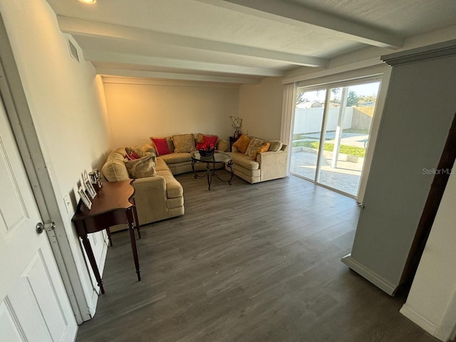 living room with beamed ceiling and wood-type flooring