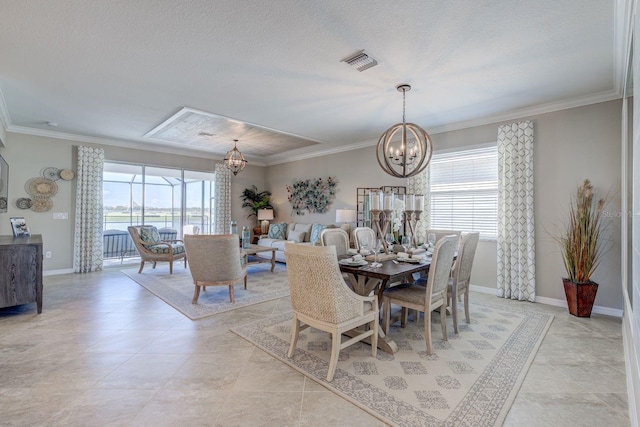 dining area featuring a chandelier, light tile patterned floors, a wealth of natural light, and ornamental molding