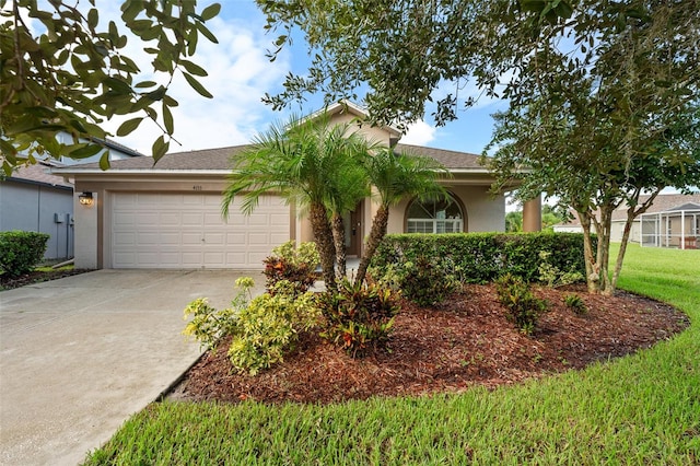 view of front of house featuring a garage and a front lawn