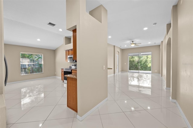 hall with light tile patterned floors