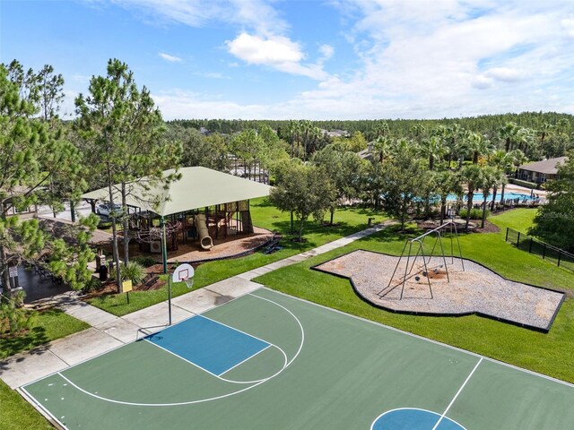 view of basketball court featuring a lawn