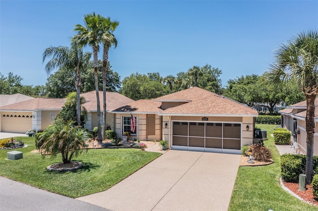 ranch-style home with a garage and a front yard