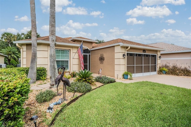 view of front facade with a garage and a front yard