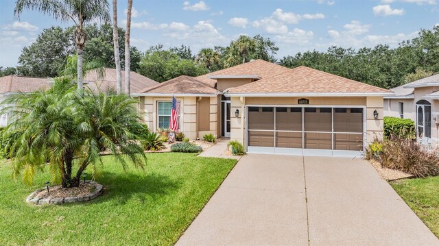 view of front facade featuring a garage and a front yard