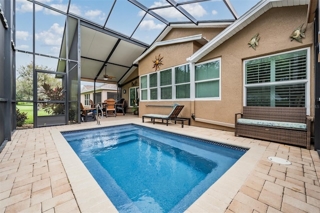 view of swimming pool featuring a lanai and a patio area