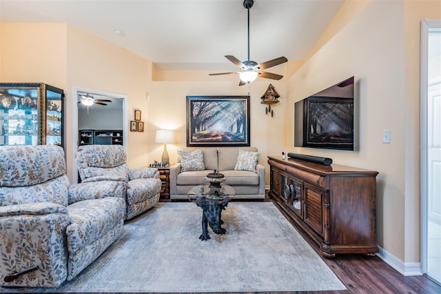 living room featuring ceiling fan, a healthy amount of sunlight, and wood-type flooring