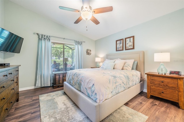 bedroom with ceiling fan, vaulted ceiling, and wood-type flooring