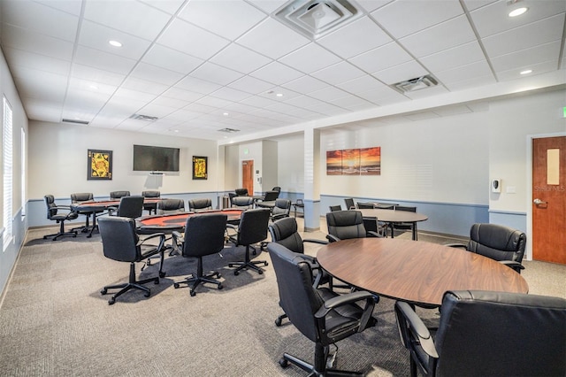 carpeted home office featuring a paneled ceiling