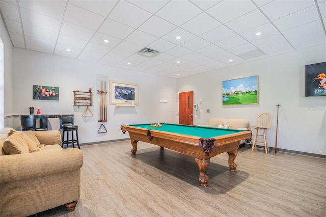 game room with billiards, a drop ceiling, and light wood-type flooring