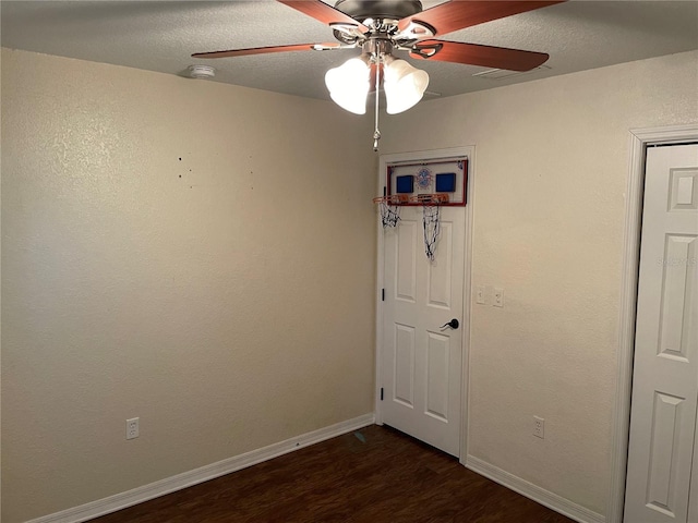 spare room with hardwood / wood-style floors and ceiling fan