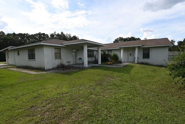 back of house with a yard