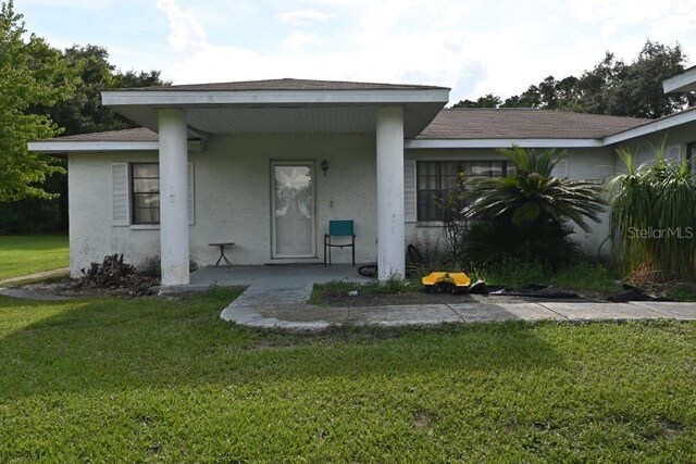 exterior space with a front lawn