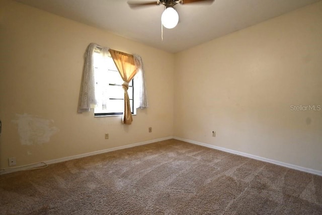 empty room with baseboards, carpet, and a ceiling fan